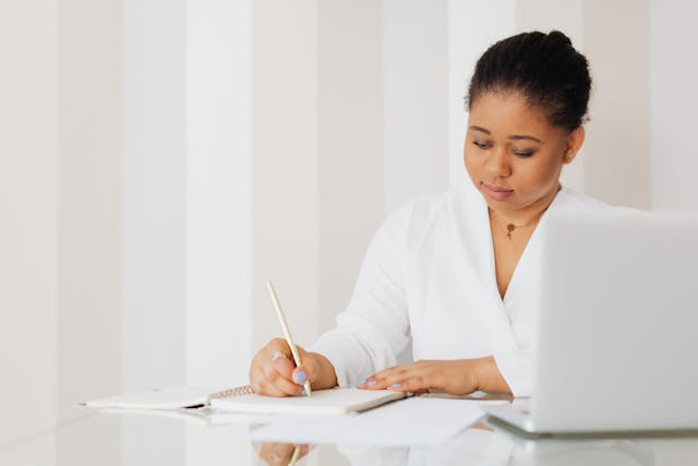 Therapist using a therapy productivity calculator app to track billable hours and improve clinic efficiency